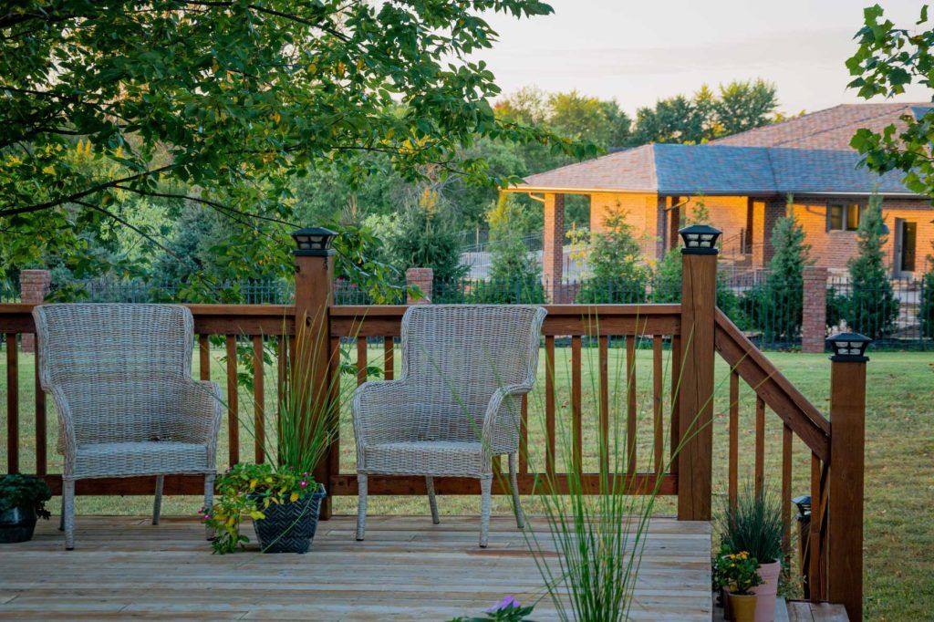 scenic view of two chair kept on the coutyard of the house in chrishchurch